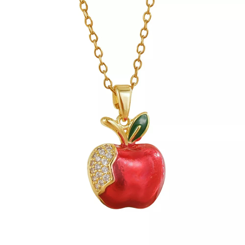 Gold-plated necklace with a red apple pendant, accented with clear crystals and green enamel leaves.