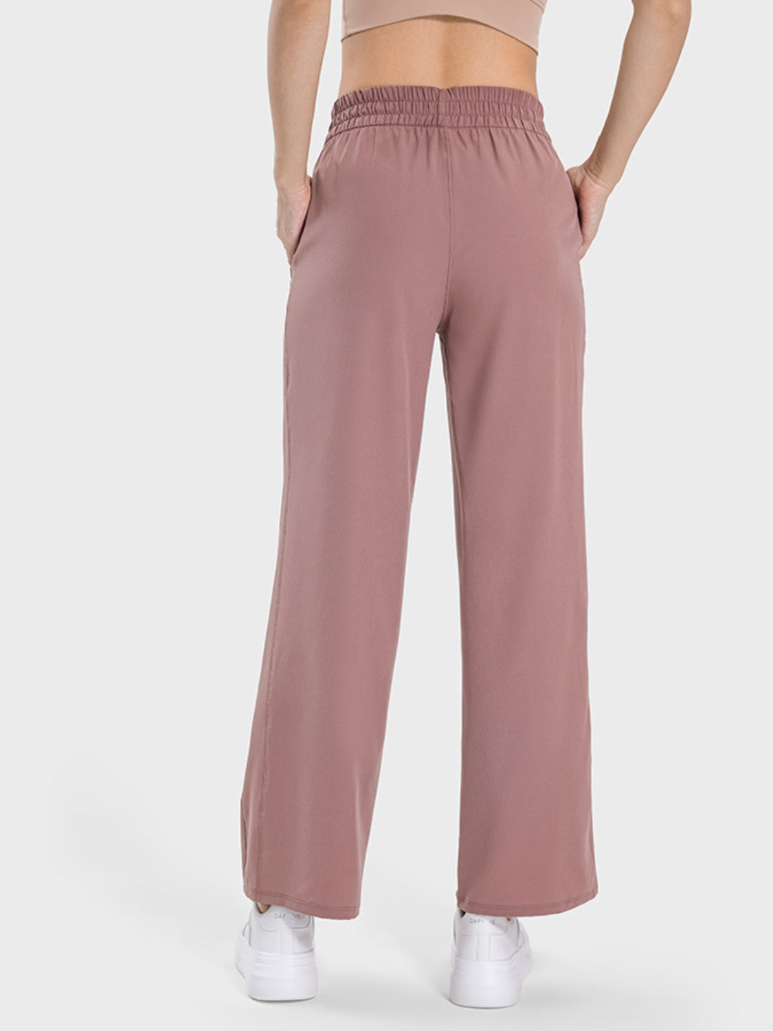 Relaxed drape drawstring palazzo pants in Light Mauve with pockets and wide legs.