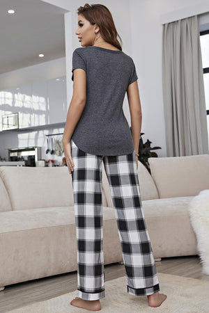 Mid gray peplum tee with short sleeves paired with black and white gingham lounge pants.