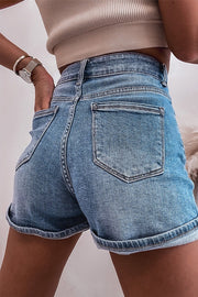 Embellished denim cuffed high-rise shorts in medium wash with five-pocket styling.