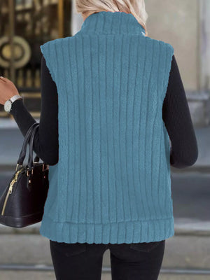 Sky blue fleece zip-up vest with ribbed texture and stand collar.