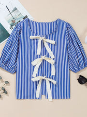 Blue striped puff sleeve blouse with three cream bow details down the back.