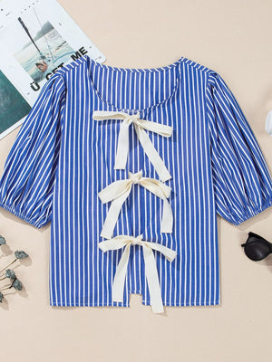 Blue striped puff sleeve blouse with three cream bow details down the back.