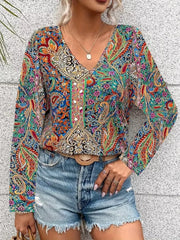 Bohemian paisley v-neck shirt in multicolor with long sleeves, styled with denim shorts.