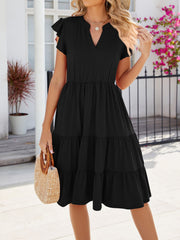 Black midi dress with ruffled short sleeves, notched V-neck, elastic waist, and tiered skirt.