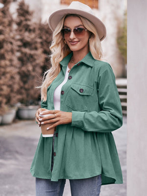 Green corduroy peplum shirt jacket with buttoned pockets and a flared hem.