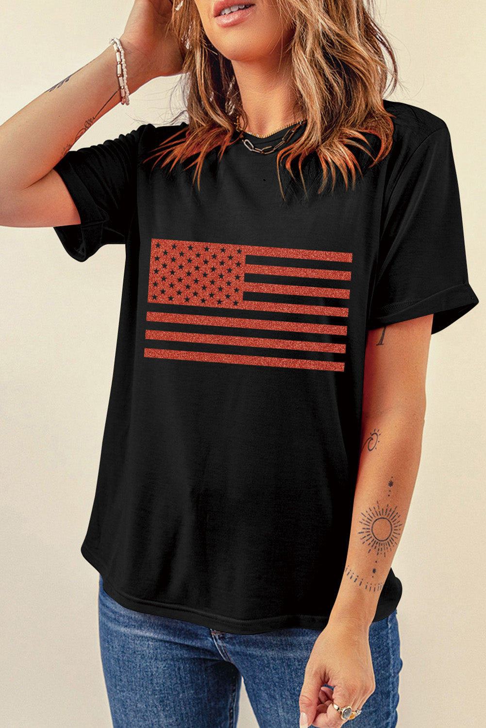 Black tee with glittered American flag graphic, crew neck, short sleeves.