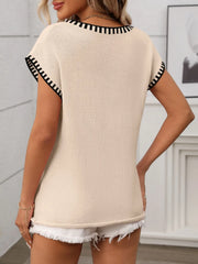 Tan knit top with black striped trim on neckline and sleeves.
