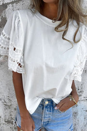 White cotton t-shirt with lace inset flutter sleeves and a crew neck.