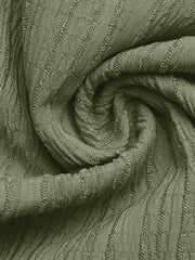 Crinkled wide-leg maternity pants in olive green with textured fabric detail.