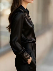 Black satin button-up shirt with lace trim on collar and cuffs