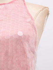 Pink iridescent sequin halter mini dress with mesh overlay and round sequins.