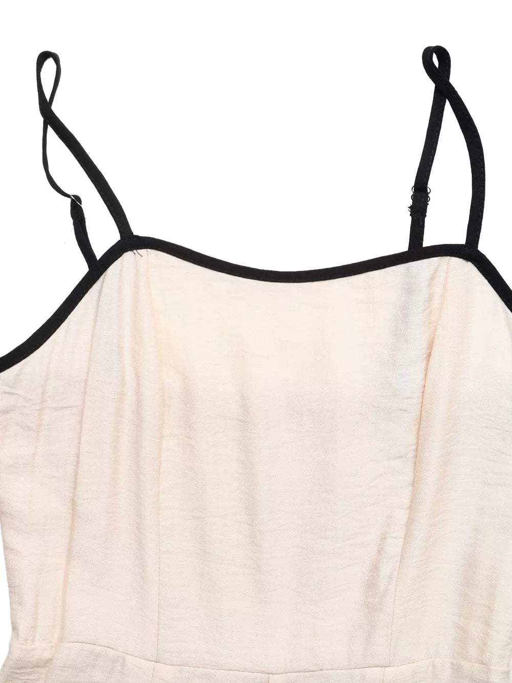 Chic Contrast Trim Wide-leg Romper in beige with adjustable spaghetti straps and black trim.