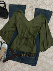 Olive green satin V-neck tie-front maternity blouse with bell sleeves.