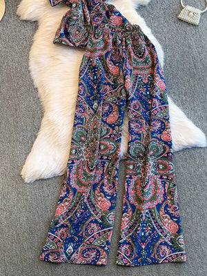 Chic cami and wide-leg pant set in navy with colorful paisley print.