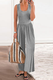 Gray gathered waist wide leg jumpsuit with scoop neck and sleeveless design