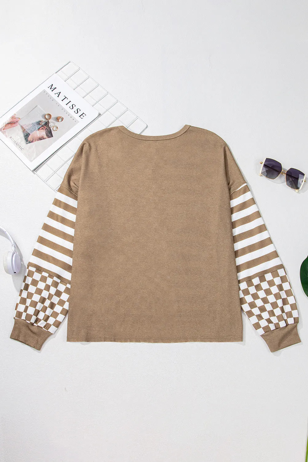 Camel knit top with asymmetrical checkered and striped sleeves