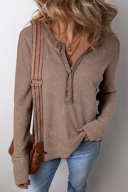 Taupe waffle knit henley blouse with button detail and notch neckline.