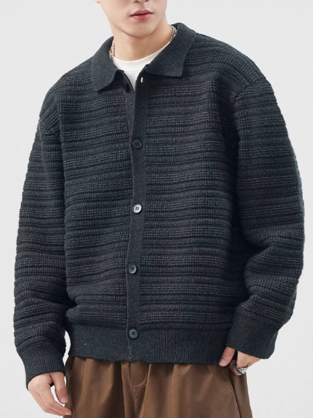 Men's dark gray ribbed knit button-down cardigan with a collar.