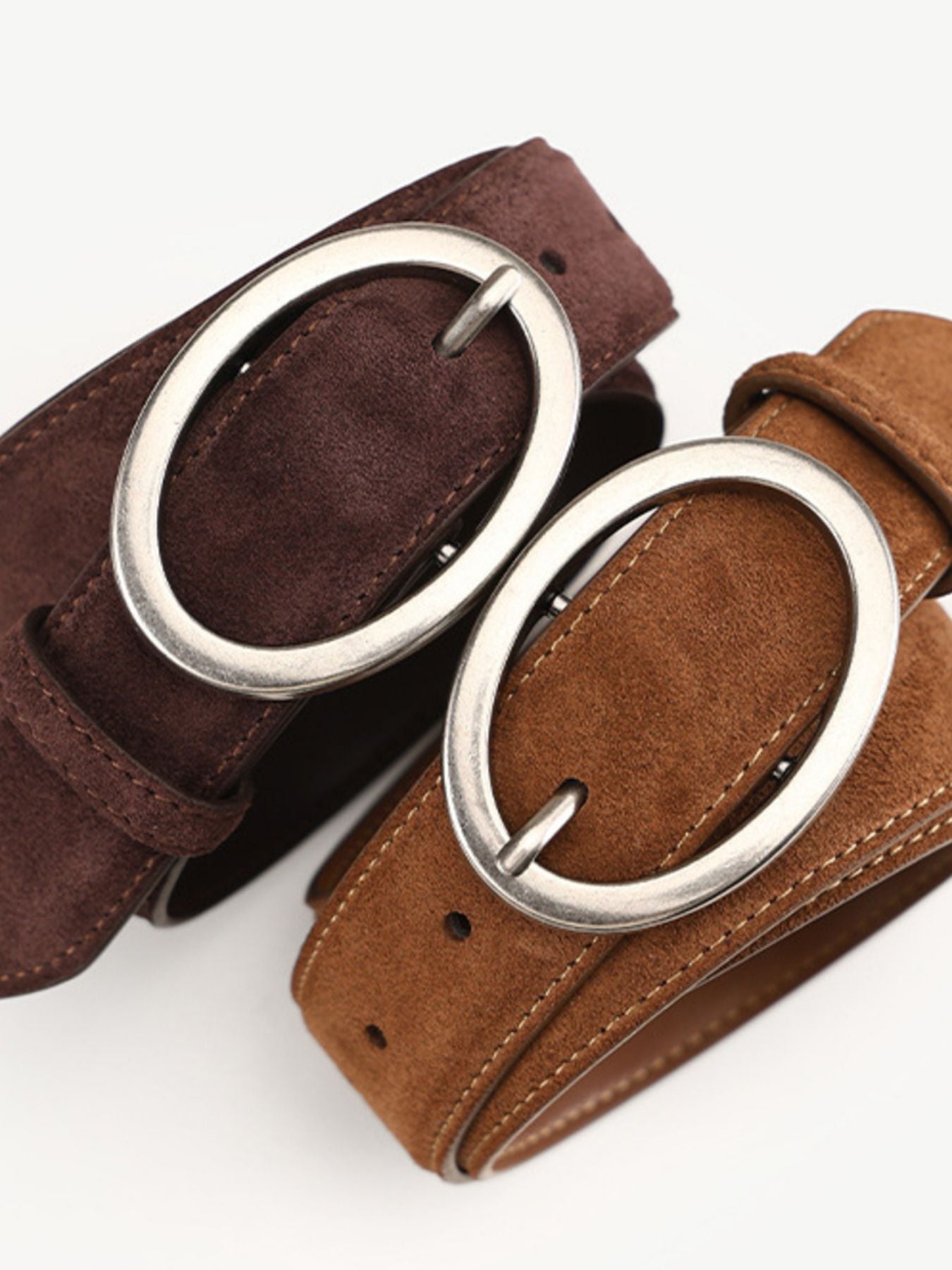 Brown and chocolate cowhide leather belts with oval brushed silver buckles