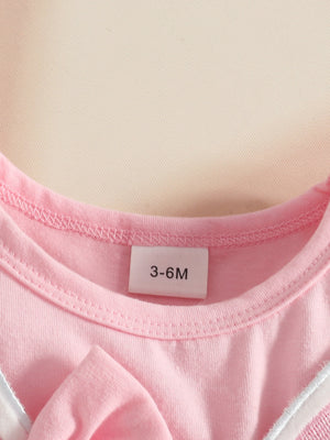 Pink baby dress with bunny applique detail and size tag 3-6M