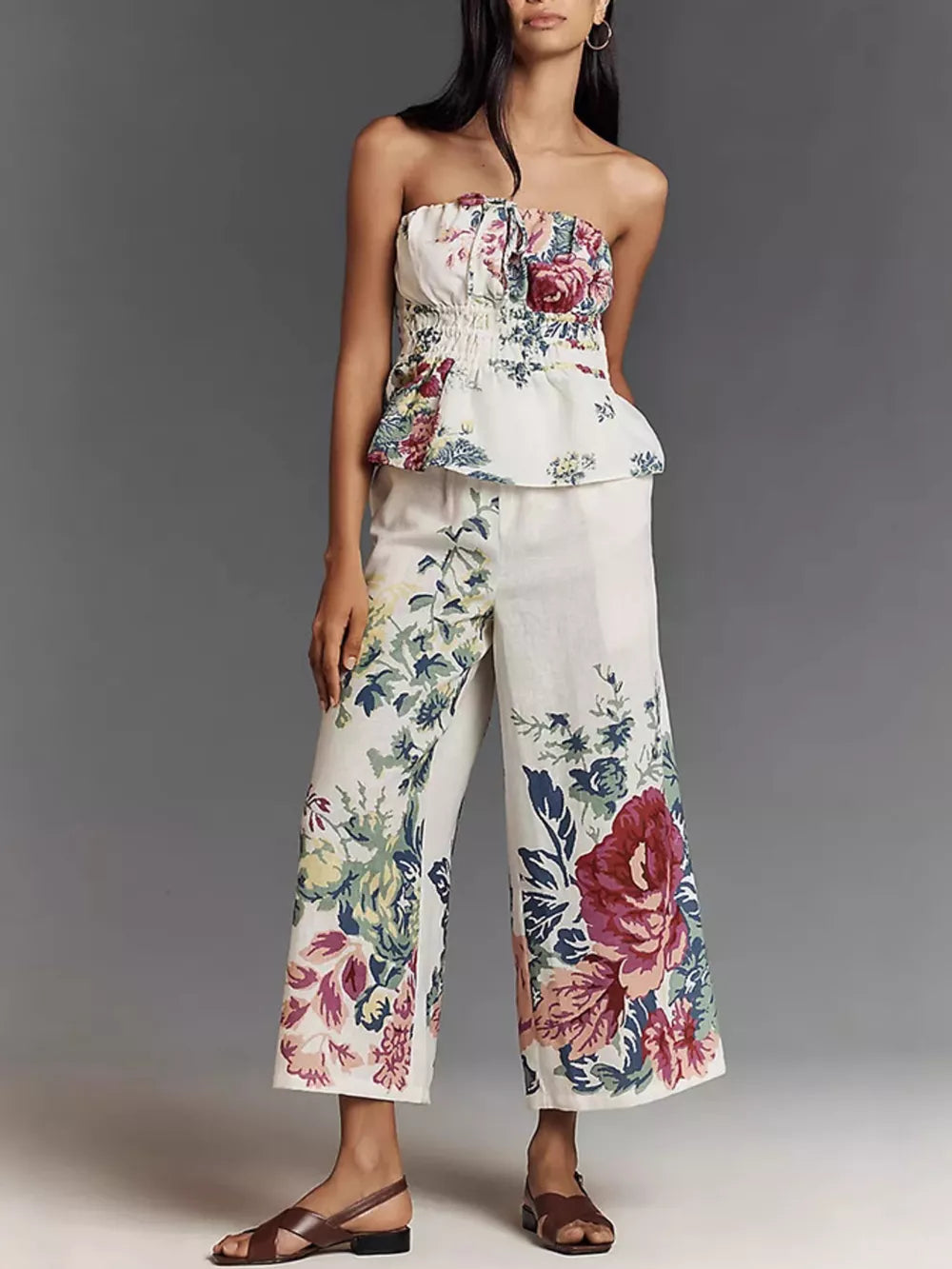 Chic floral ruched strapless top and wide-leg pants set in white polyester.