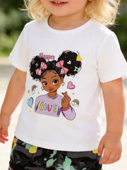 White cartoon graphic t-shirt with "Happy Love" print and camo pants.