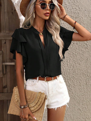 Black ruffled sleeve blouse with plunge neckline and tie detail.