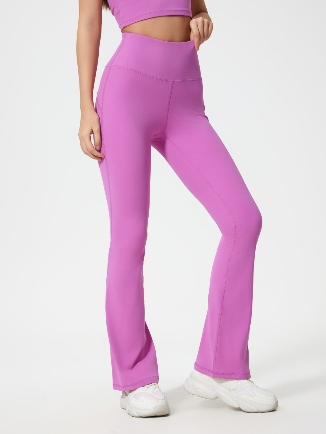 Flared sculpt leggings in Heliotrope Purple with high-rise waist and subtle seam details.