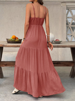 Tiered maxi dress in rust with smocked bodice and spaghetti straps.