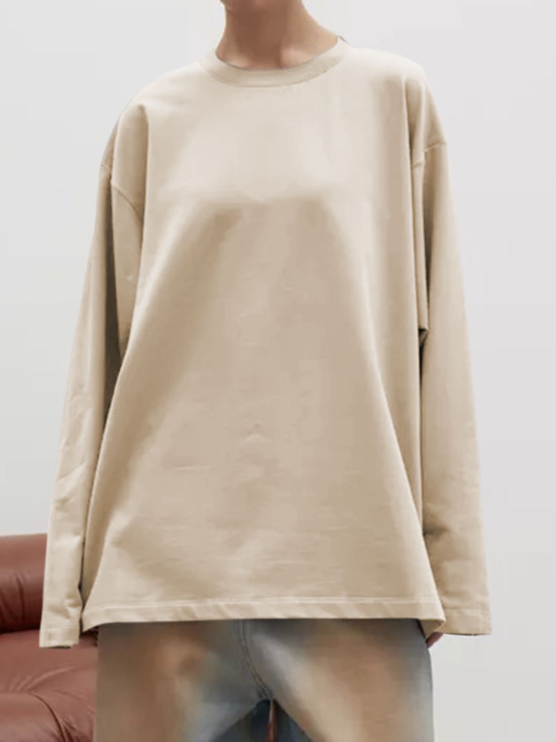 Oversized crewneck sweatshirt in tan with voluminous long sleeves and a relaxed fit.