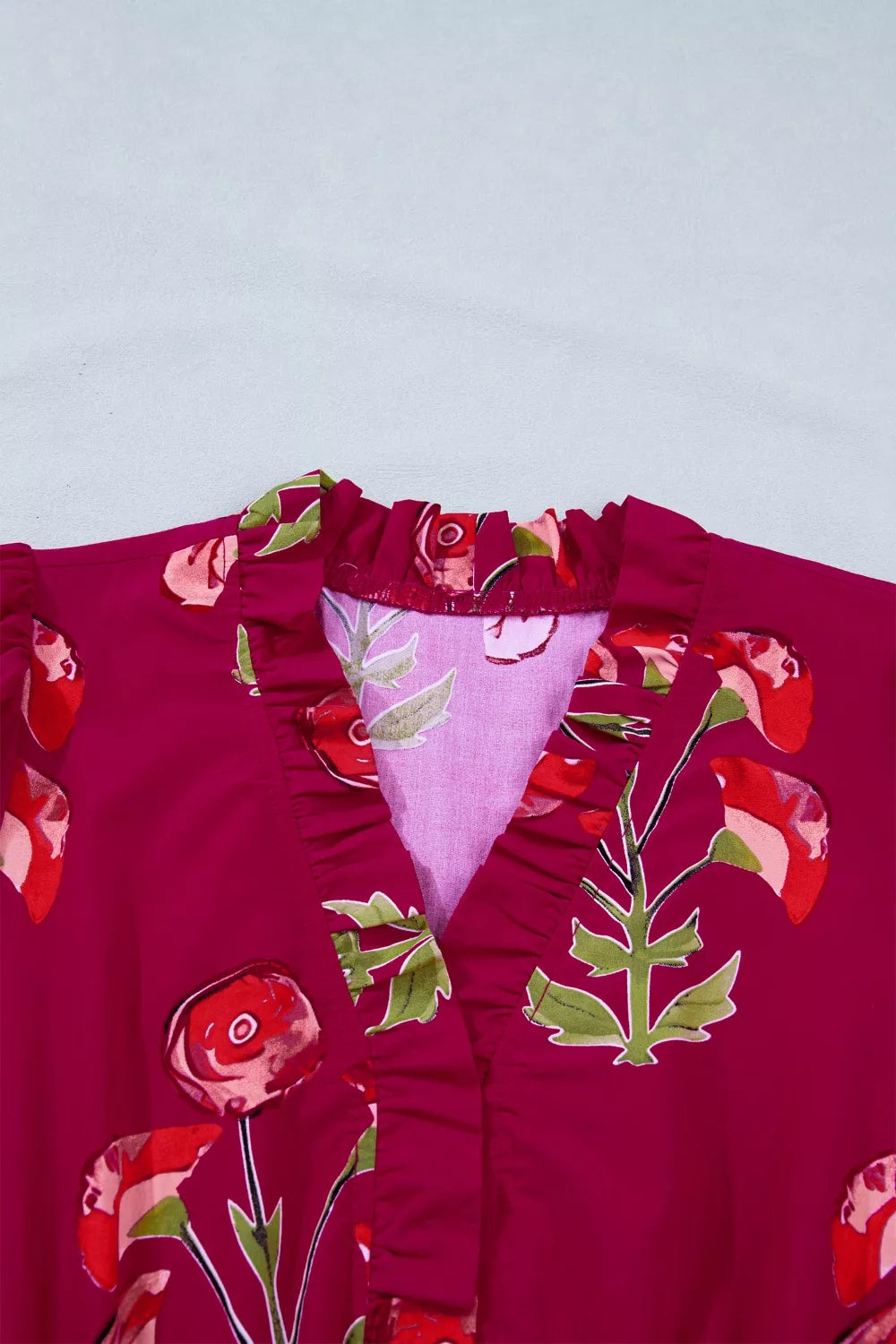 Charming Floral Tiered Midi Dress in berry with ruffled V-neck and floral print.