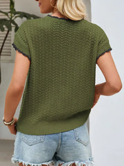 Green knit maternity cardigan with short sleeves and textured chevron pattern.