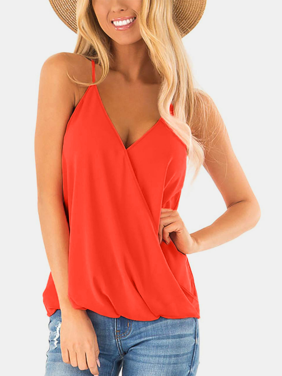 Orange draped crossover halter cami with V-neck and thin straps.