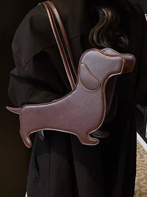 Charming dachshund shoulder bag in coffee pu leather with white stitching.