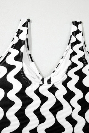 Black and white wave print one-piece swimsuit with V-neckline and bow detail