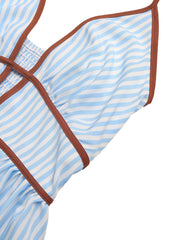 Blue and white striped maxi dress with halter neckline and brown trim detail