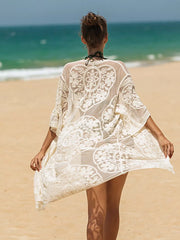 Apricot floral lace kimono cover-up with intricate embroidery and sheer fabric.