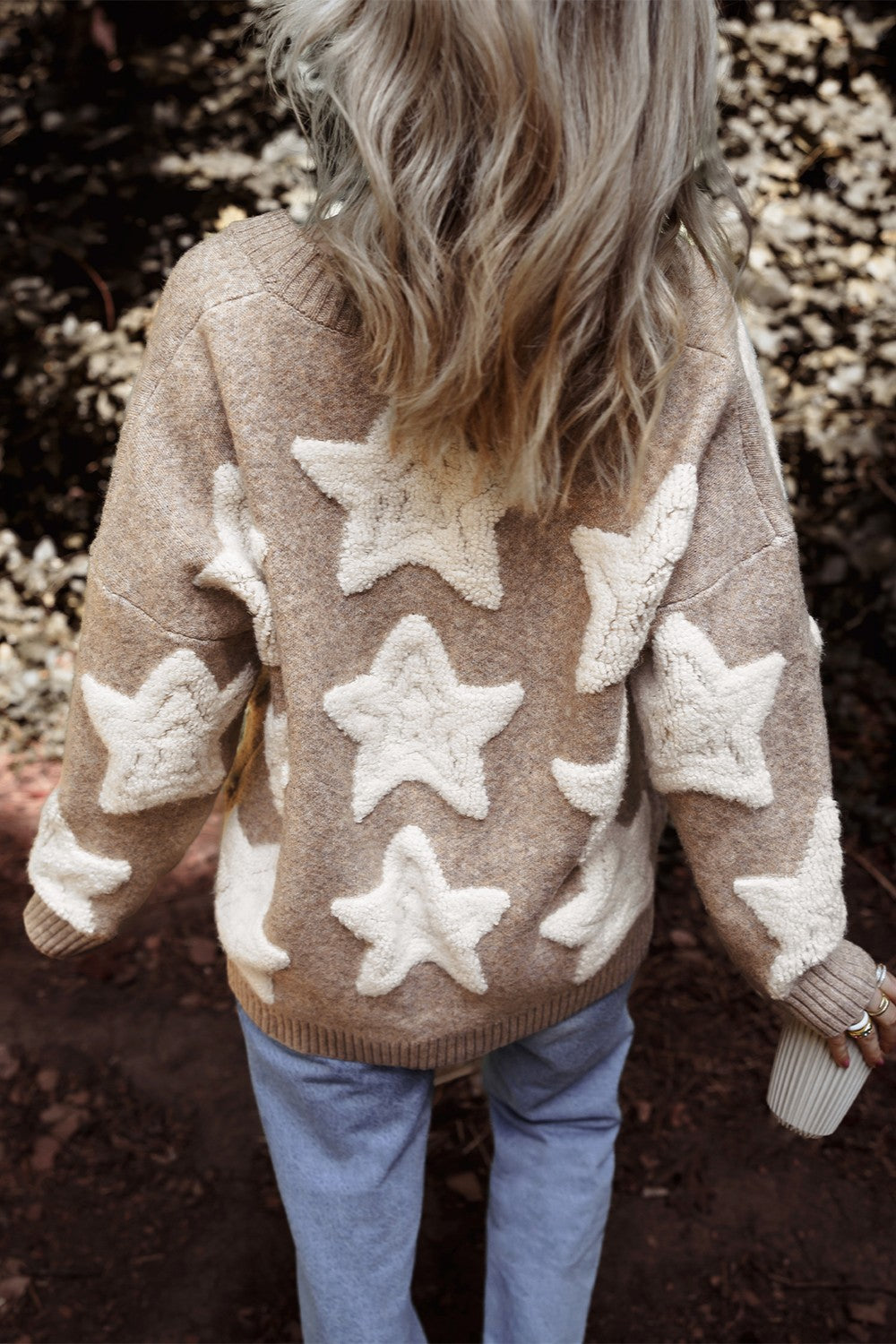 Textured starburst knit cardigan in mocha with white star appliques.