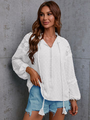 White textured blouse with lace trim and tie neck, long sleeves