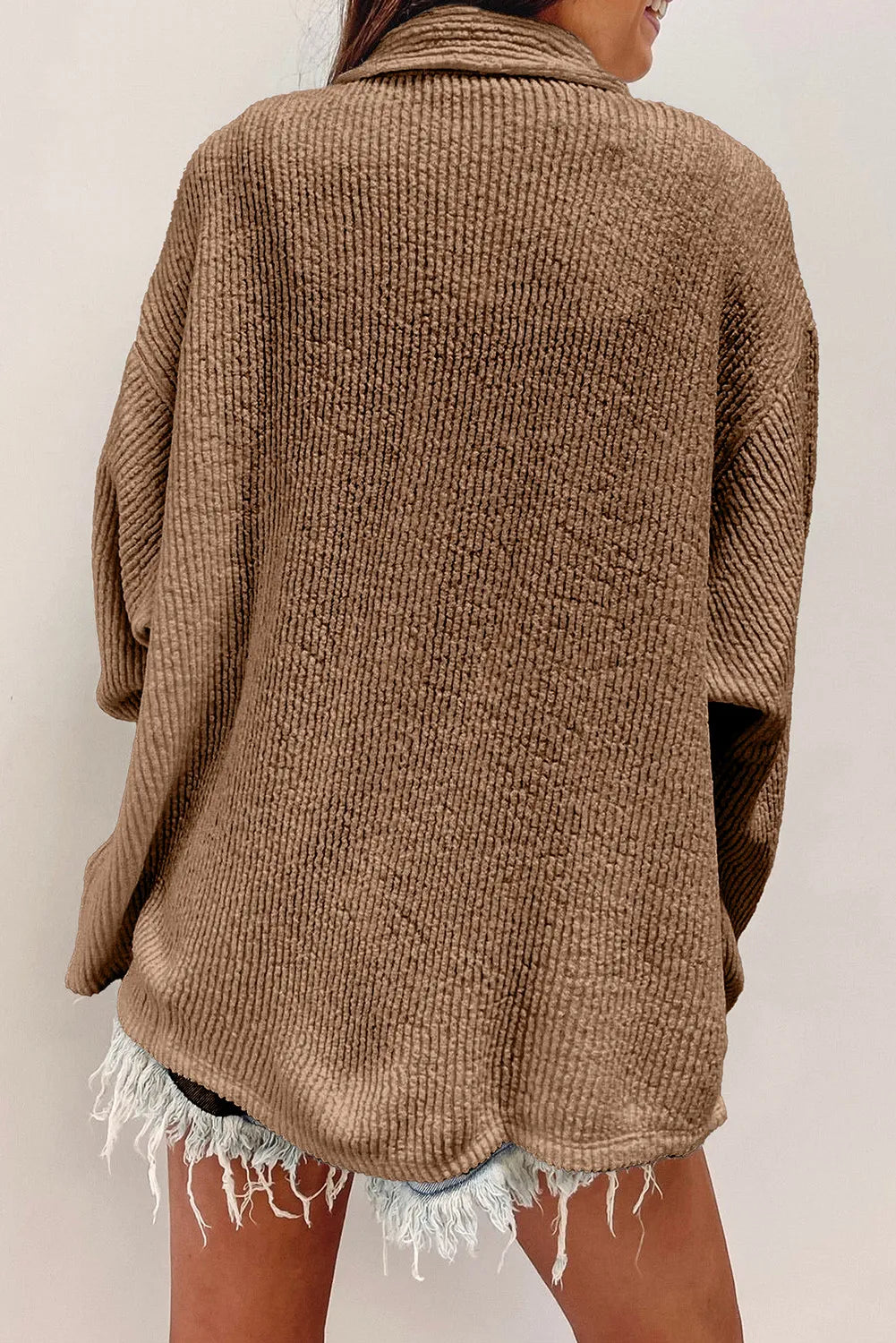 Camel textured corduroy overshirt with button front and patch pockets.