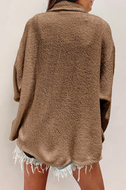 Camel textured corduroy overshirt with button front and patch pockets.