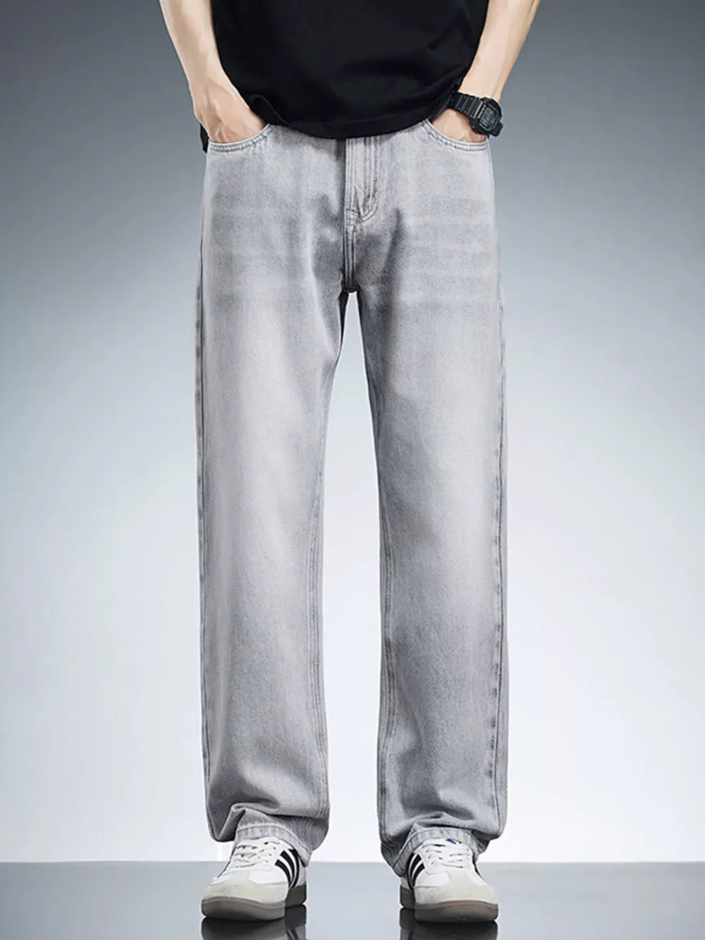 Men's light grey relaxed fit wide leg cotton jeans with a casual contemporary style.