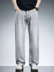 Men's light grey relaxed fit wide leg cotton jeans with a casual contemporary style.