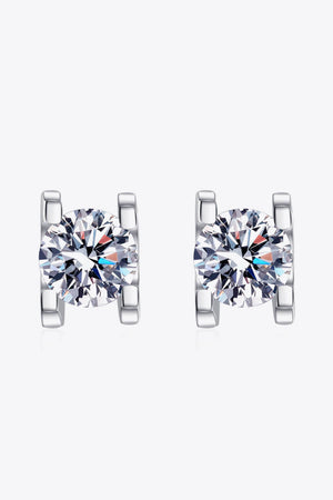 Silver moissanite stud earrings with sculpted settings.