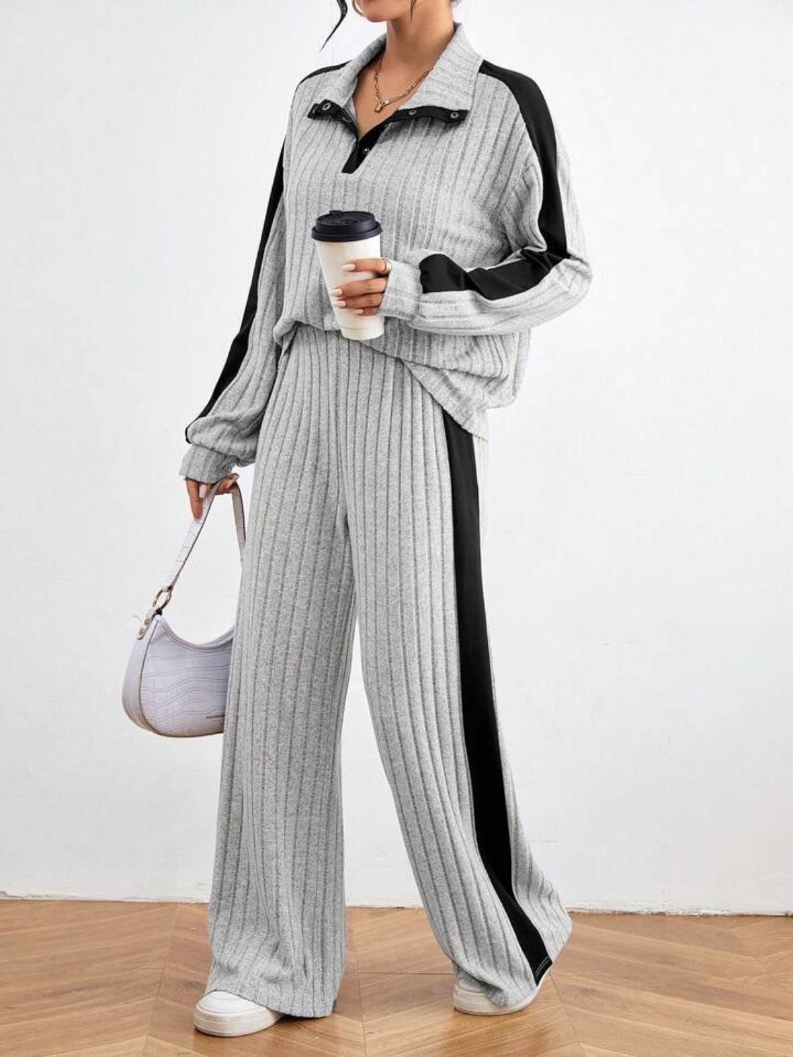 Light gray ribbed lounge set with contrast black stripe detail and polo collar.