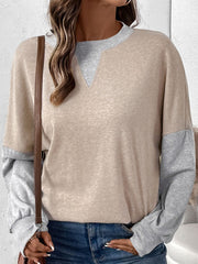 Layered V-neck sweatshirt in tan and gray colorblock with long sleeves.