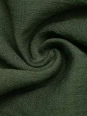 Dark green cotton blend fabric detail of a maxi gown.
