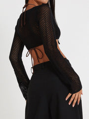 Black crochet tie-front bolero shrug with long sleeves and a mesh pattern.