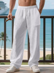 White linen jogger pants with drawstring waist and side pockets.